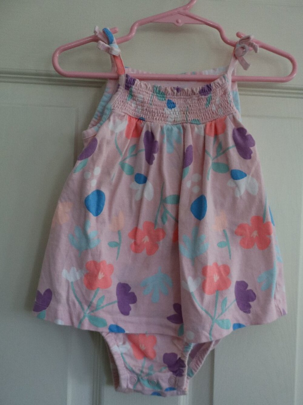 Pink Carter's one piece faux dress w/ snap bottom. Summer florals 100% cotton